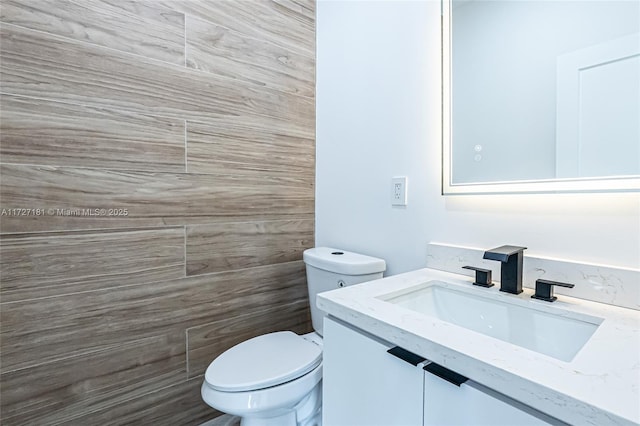 bathroom with toilet and vanity