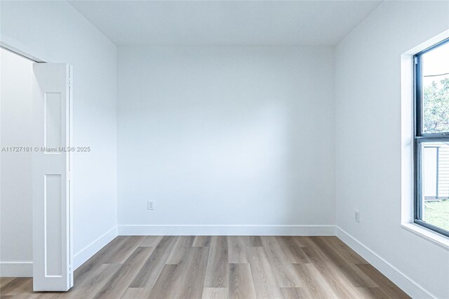 unfurnished room featuring light hardwood / wood-style flooring