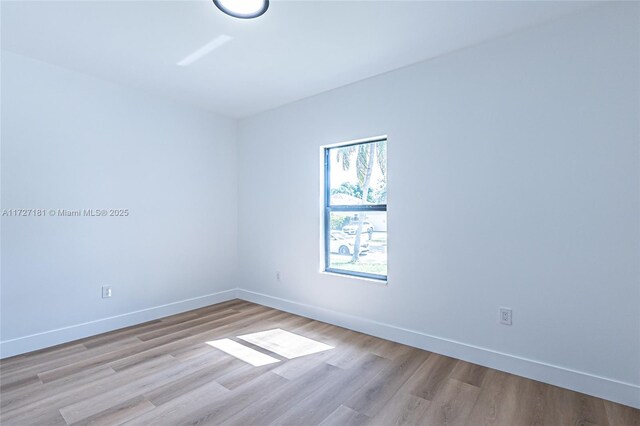 empty room with light hardwood / wood-style floors