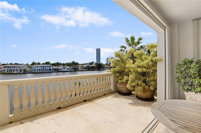 balcony featuring a water view