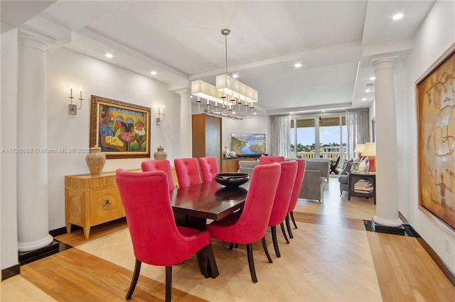 dining area with a chandelier and light wood-type flooring