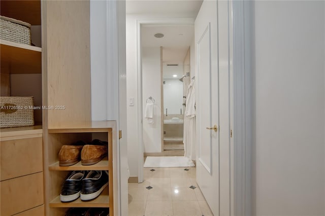 hallway featuring light tile patterned floors