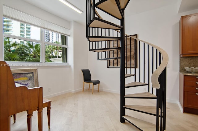 stairs featuring wood-type flooring