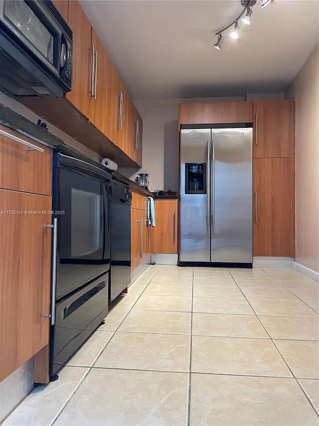 kitchen featuring light tile patterned floors, black dishwasher, stainless steel refrigerator with ice dispenser, brown cabinets, and dark countertops