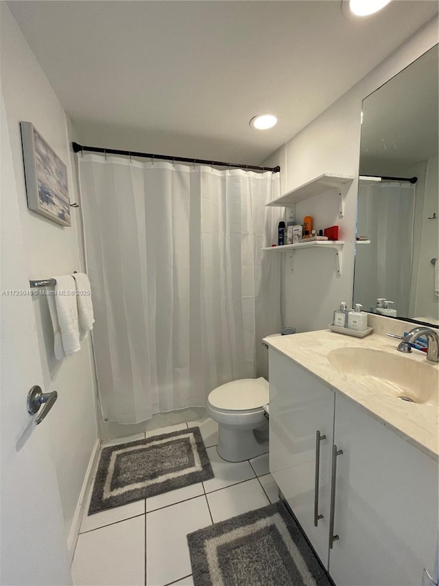 bathroom with toilet, tile patterned flooring, vanity, and recessed lighting