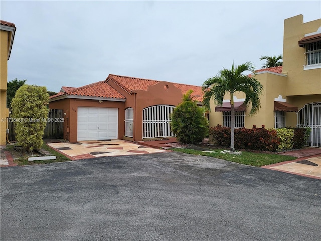 view of front of property with a garage