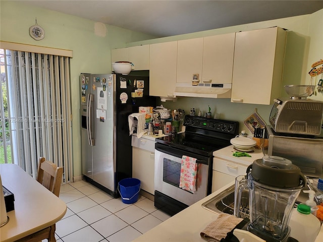 kitchen featuring white cabinetry, light tile patterned floors, and stainless steel appliances