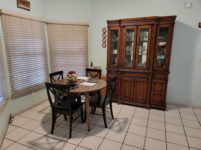 dining area with light tile patterned floors