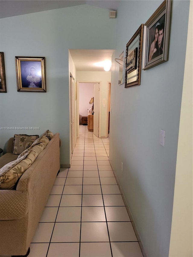 corridor featuring light tile patterned flooring