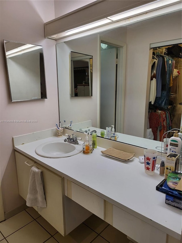 bathroom with tile patterned flooring and vanity