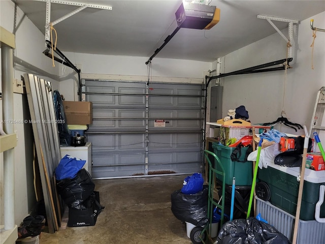 garage featuring a garage door opener and electric panel