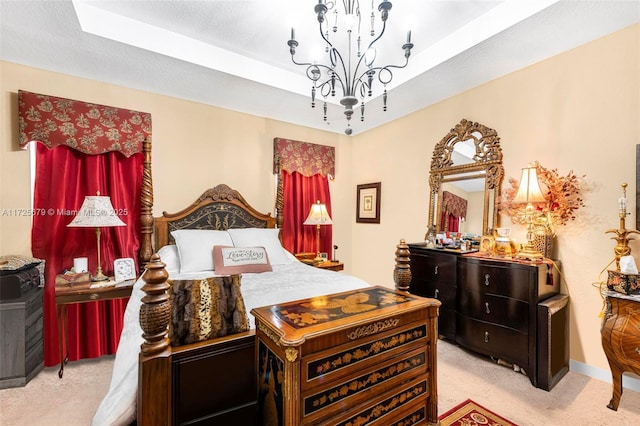 carpeted bedroom featuring a textured ceiling and an inviting chandelier