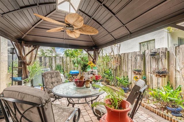 view of patio with ceiling fan and a gazebo