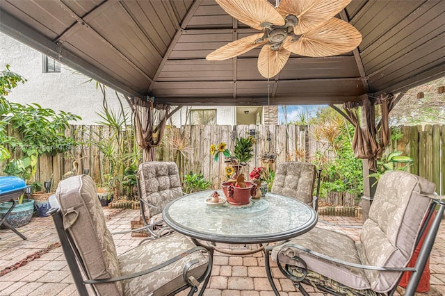 view of patio / terrace with ceiling fan and a gazebo