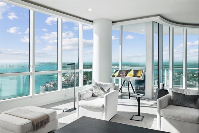 100 S Pointe Dr Unit 3203, Miami Beach, FL 33139 - living area with a water view, a wall of windows, and recessed lighting