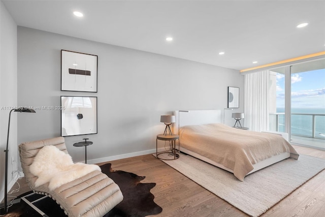 100 S Pointe Dr Unit 3203, Miami Beach, FL 33139 - bedroom featuring access to outside, wood finished floors, recessed lighting, and baseboards