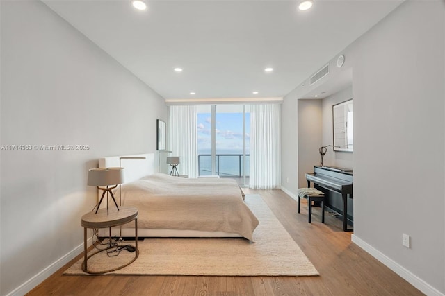 100 S Pointe Dr Unit 3203, Miami Beach, FL 33139 - bedroom featuring baseboards, wood finished floors, and recessed lighting