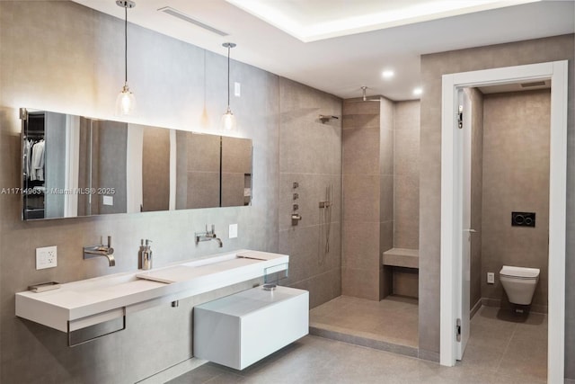 100 S Pointe Dr Unit 3203, Miami Beach, FL 33139 - bathroom featuring a walk in shower, toilet, tile patterned flooring, and double vanity