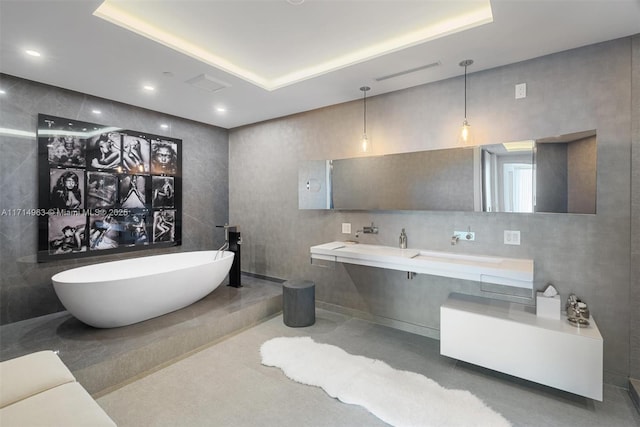100 S Pointe Dr Unit 3203, Miami Beach, FL 33139 - bathroom featuring a freestanding tub, a tray ceiling, and double vanity