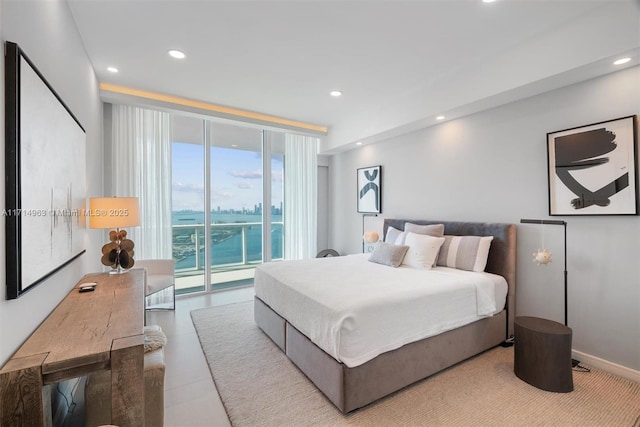 100 S Pointe Dr Unit 3203, Miami Beach, FL 33139 - bedroom featuring access to outside, recessed lighting, a water view, a wall of windows, and baseboards
