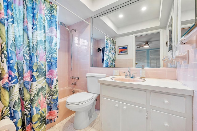 full bathroom with shower / tub combo with curtain, ceiling fan, tile walls, vanity, and toilet