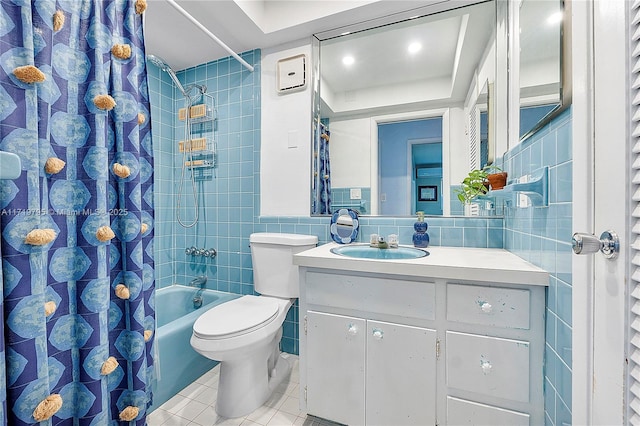 3209 Colony Club Rd Unit 1-W, Pompano Beach, FL 33062 - full bathroom featuring tile patterned flooring, tile walls, vanity, shower / tub combo with curtain, and toilet