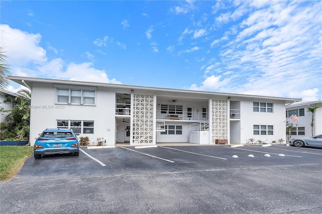 3209 Colony Club Rd Unit 1-W, Pompano Beach, FL 33062 - view of building exterior with uncovered parking