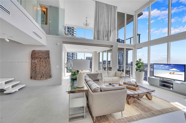 living room with a towering ceiling