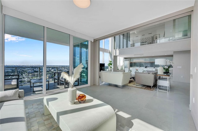 living room featuring floor to ceiling windows