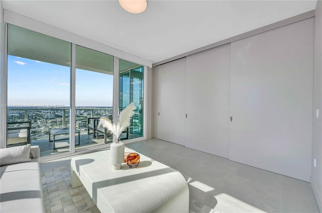 living room featuring a wall of windows