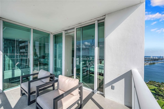 balcony featuring a water view