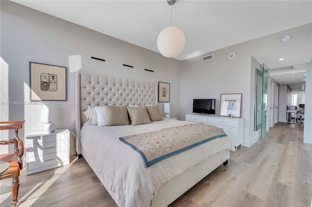 bedroom featuring light hardwood / wood-style floors