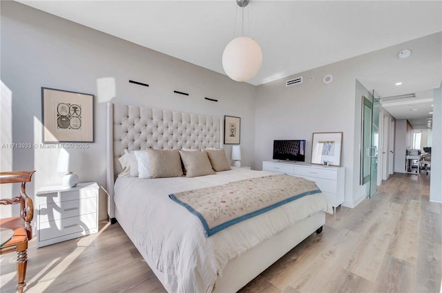 bedroom featuring light hardwood / wood-style floors