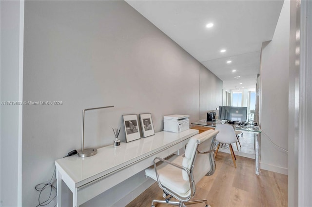 office space with light wood-type flooring