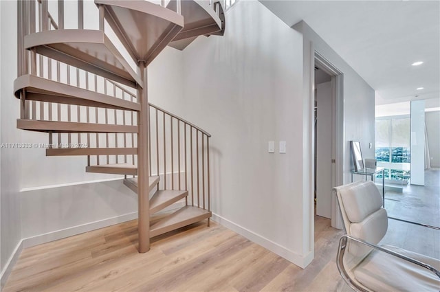 stairs with wood-type flooring