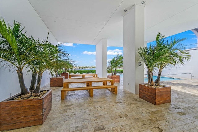 view of patio / terrace featuring a water view