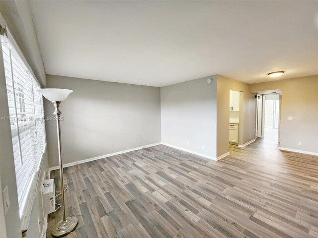 unfurnished room featuring dark wood-type flooring