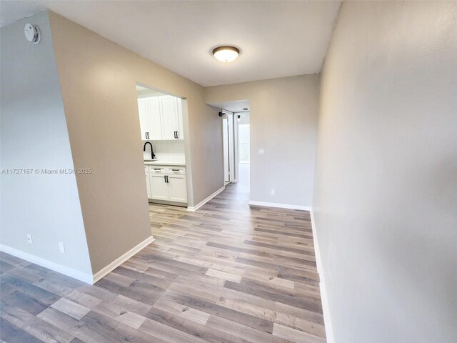 spare room featuring light hardwood / wood-style flooring