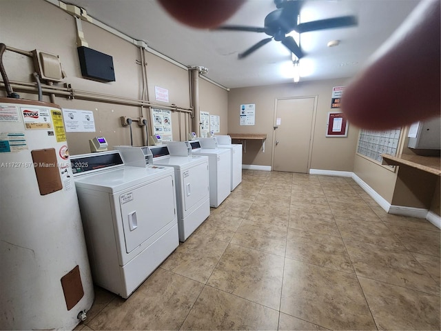 community laundry room featuring light tile patterned floors, ceiling fan, separate washer and dryer, and gas water heater