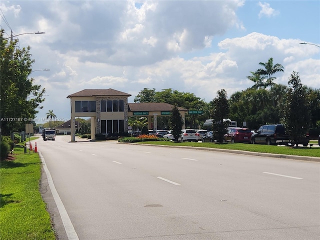 view of road with street lighting and curbs