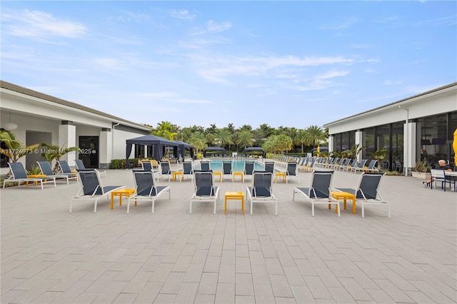 view of patio featuring a community pool