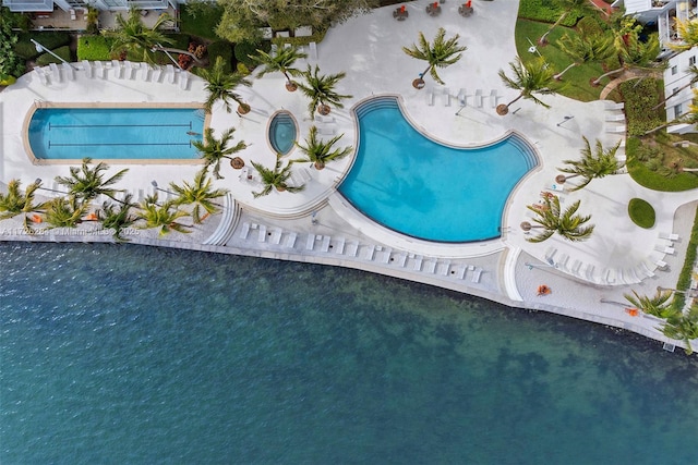 birds eye view of property with a water view