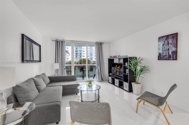 tiled living room with floor to ceiling windows