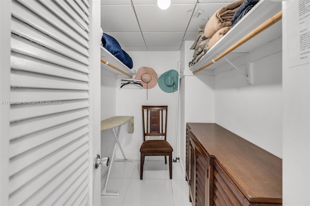 spacious closet with light tile patterned floors