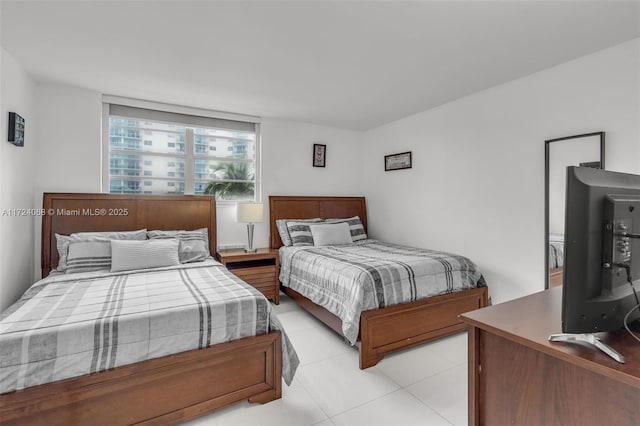 bedroom featuring light tile patterned flooring