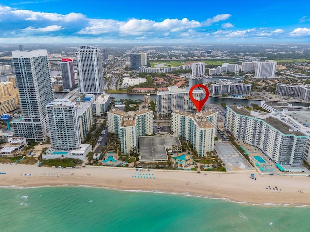 aerial view featuring a water view and a view of the beach