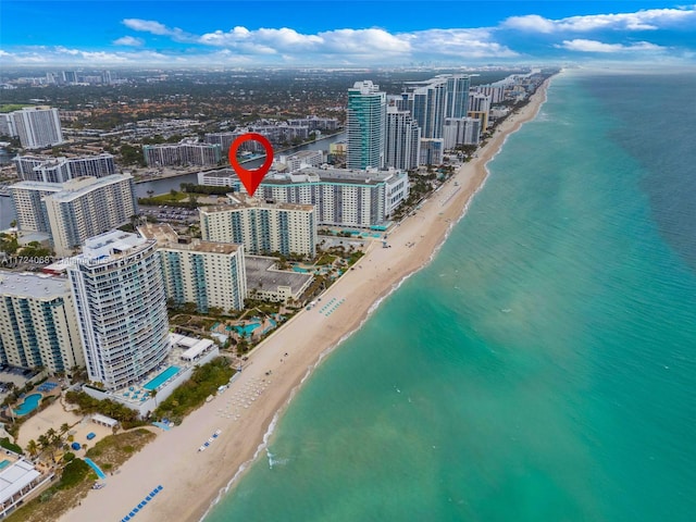 bird's eye view featuring a view of the beach and a water view