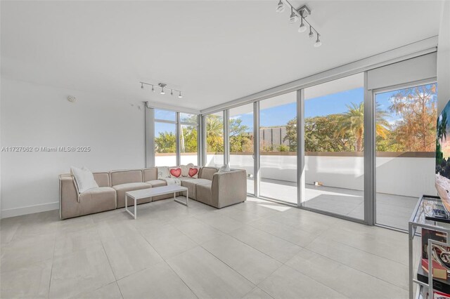 tiled living room with rail lighting