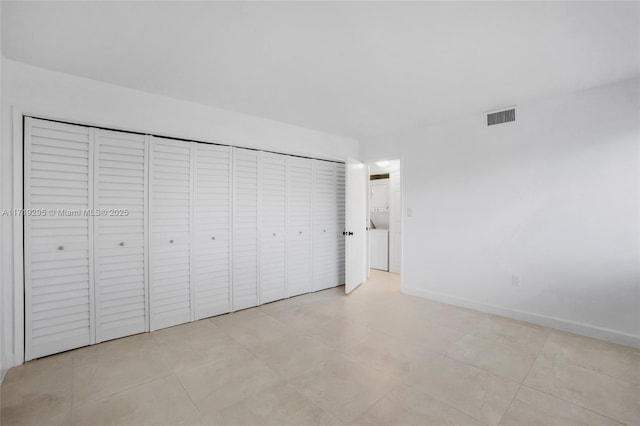 unfurnished bedroom with visible vents and baseboards