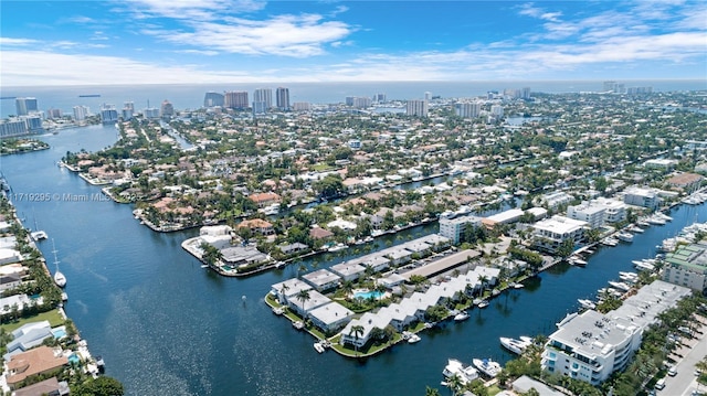 birds eye view of property featuring a view of city and a water view